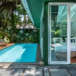 Bedroom opening onto a private pool at a two-bedroom pool villa at Blu Monkey Pooltara Krabi